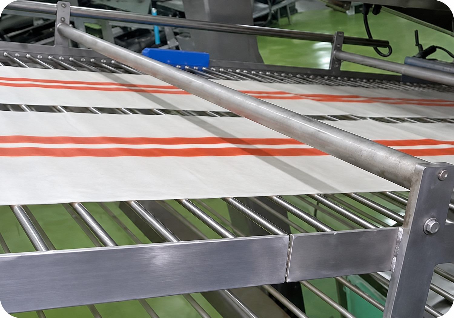 Close-up of conveyor and processing components on a YUKE crab stick line